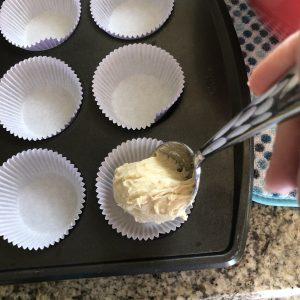 Spooning batter into cupcake pan